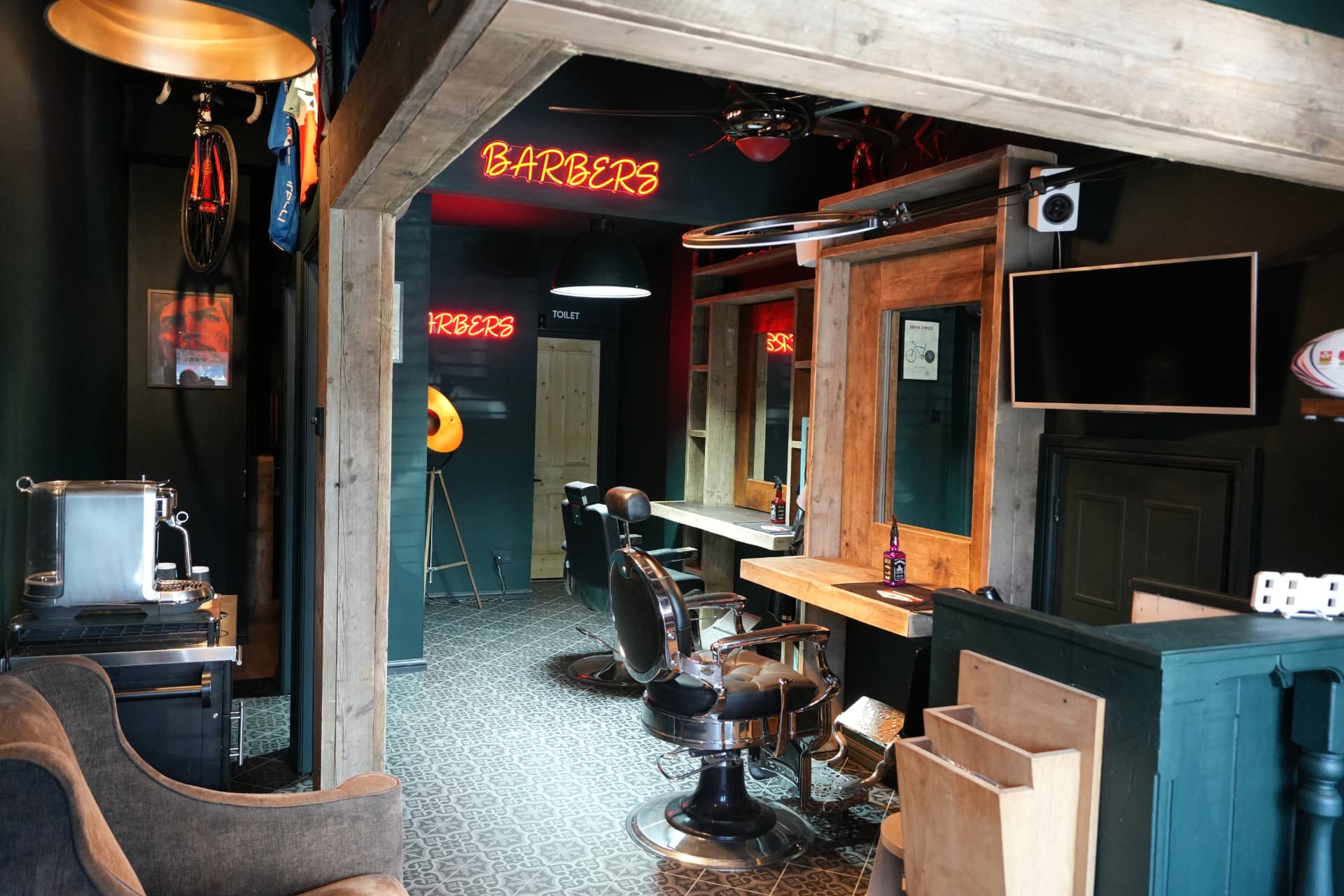Inside Yeti barbershop: timber workstations, chrome chairs and red neon